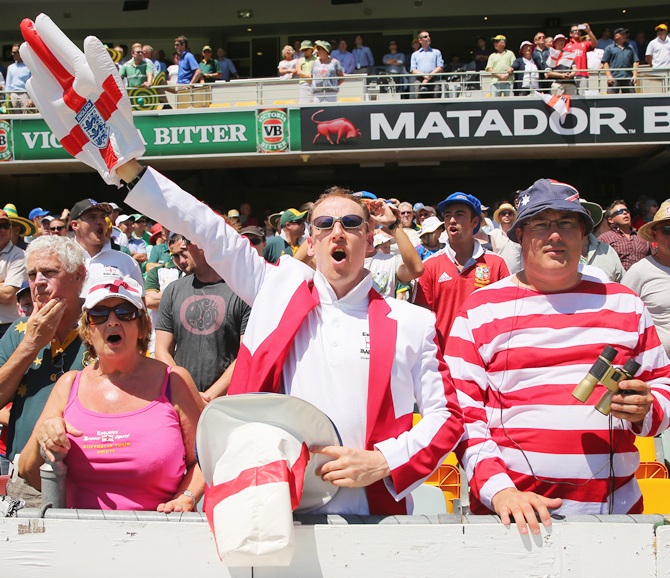 Barmy Army members stand for the national anthem