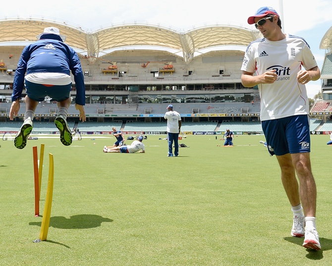 England captain Alastair Cook and Monty Panesar warm up