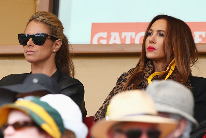 Candice Falzon, partner of David Warner and Kyly Clarke, partner of Michael Clarke look on during day one of the Second Ashes Test