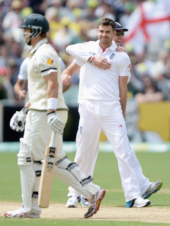James Anderson of England celebrates with Graeme Swann after dismissing Shane Watson of Australia