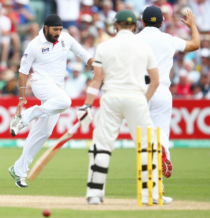 Monty Panesar of England celebrates after taking the wicket of Steve Smith of Australia