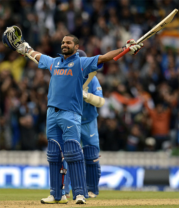 India's Shikhar Dhawan celebrates as he reaches his century during the ICC Champions Trophy