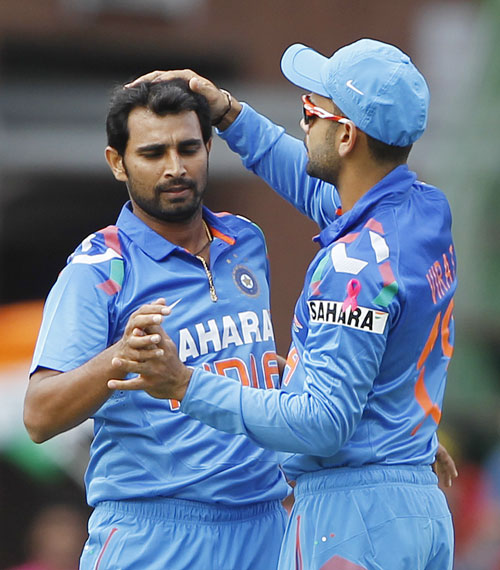 India's Mohammed Shami is congratulated by Virat Kohli (right) after getting out South Africa's Jacques Kallis