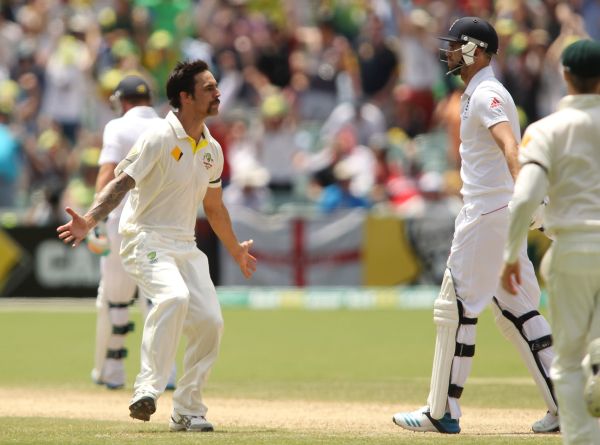Mitchell Johnson of Australia looks at James Anderson of England after bowling him out
