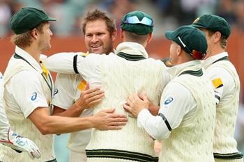 Ryan Harris of Australia is congratulated by team mates 