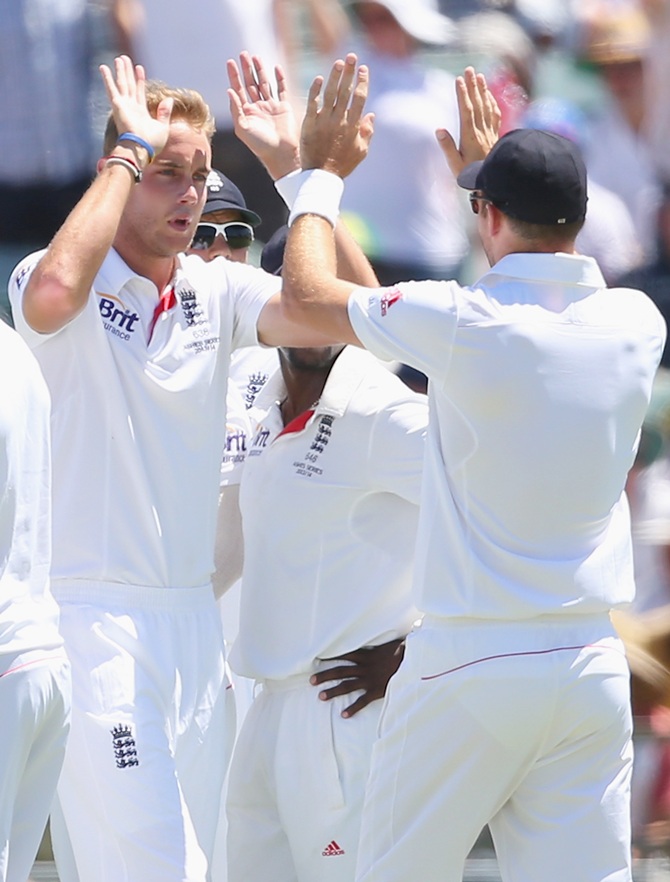 Stuart Broad of England is congratulated by James Anderson after taking the wicket of Mitchell Johnson of Australia