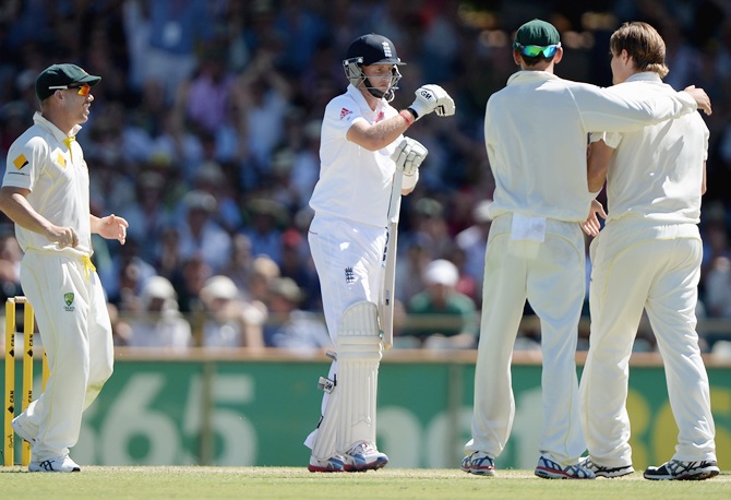 Joe Root of England reviews his wicket after Shane Watson of Australia dismisses him