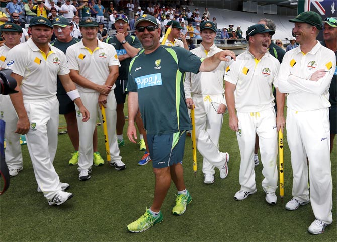 Australia's coach Darren Lehmann (centre) jokes with his players after winning the Ashes in Perth