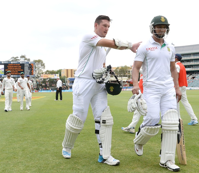 Graeme Smith and Alviro Petersen of South Africa walks off at tea during day 4 of the 1st Test match