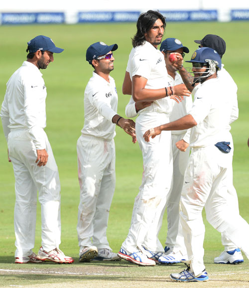 Ishant Sharma is congratulated by teammates after taking a wicket