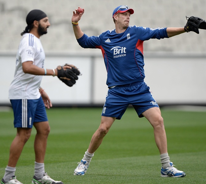Boyd Rankin and Monty Panesar of England take part in a fielding drill during a nets session