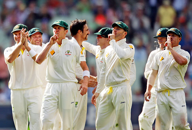Peter Siddle, Michael Clarke and David Warner gesture towards the Bramy Army after Mitchell Johnson dismissed Jonny Bairstow on Day 1 of the Fourth Ashes Test at Melbourne Cricket Ground on Thursday