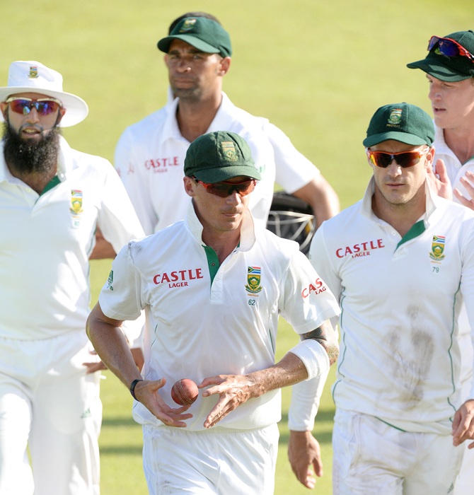 Dale Steyn of South Africa walks off with the match ball after his 22nd five-wicket haul during Day 2 of the 2nd Test match between South Africa and India