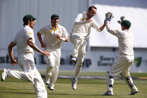 Nathan Lyon celebrates after picking up a wicket