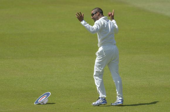 Shikhar Dhawan celebrates after taking the catch to send back Graeme Smith