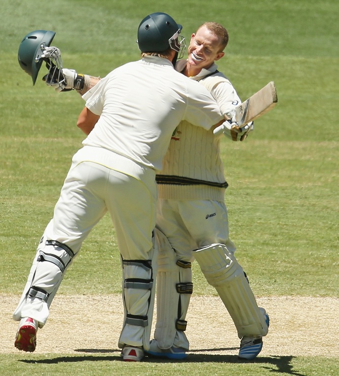 Chris Rogers of Australia is congratulated by Shane Watson of Australia after reaching his century