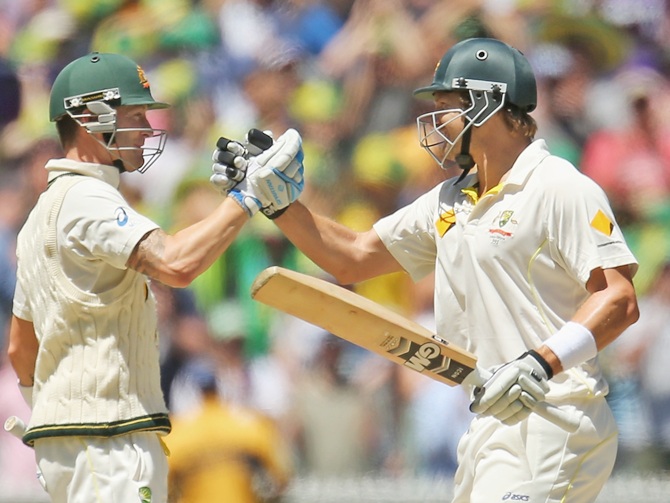 Michael Clarke (left) and Shane Watson of Australia embrace as Australia win the match