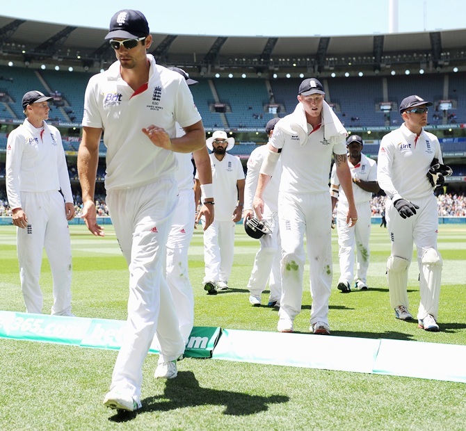 England captain Alastair Cook and his team leave the field