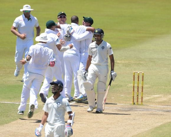South African players celebrate after dismissing Rohit Sharma