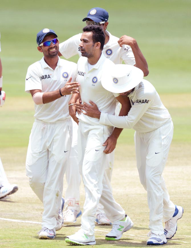 Zaheer Khan (centre) celebrates a wicket with his teammates
