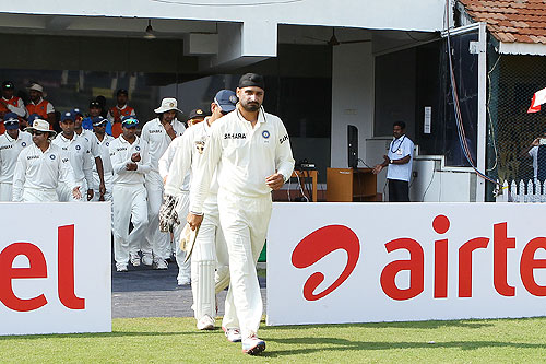 Harbhajan Singh leads out the team on his 100th Test appearance on Day 1 of the 1st Test between India and Australia at the MA Chidambaram Stadium in Chennai on Friday