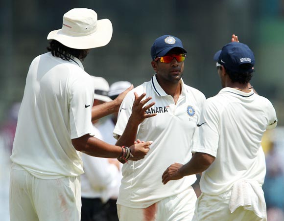 Ravichandran Ashwin, centre, celebrates with teammates.