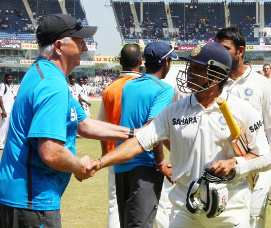 Sachin Tendulkar is congratulated by coach Duncan Fletcher