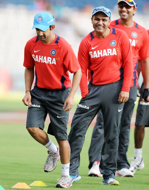 Virender Sehwag of India with teammates during a practice session