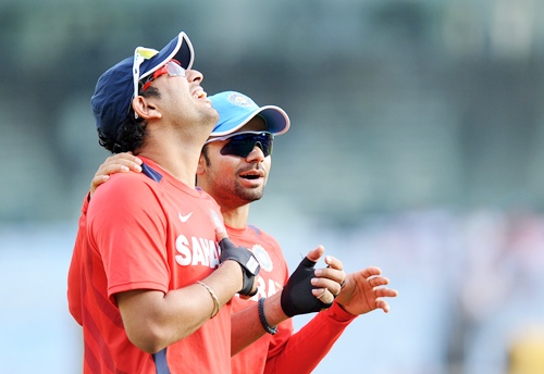 Yuvraj Singh of India shares a lighter moment with teammate Virat Kohli