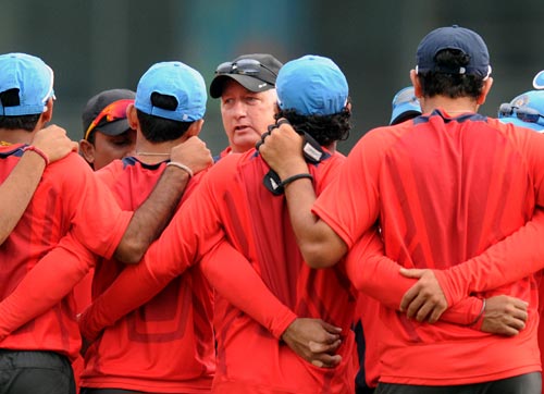 India coach Duncan Fletcher speaks to his team during a practice session
