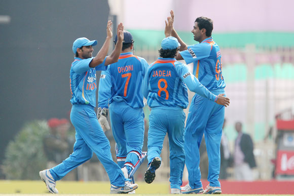 Ravichandran Ashwin of India celebrates the wicket of Eoin Morgan of England