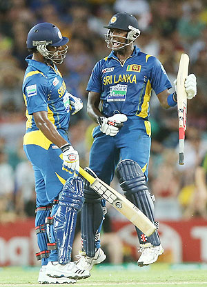 Thisara Perera and Angelo Mathews of Sri Lanka celebrate after winning the first Twenty20 international against Australia on Saturday