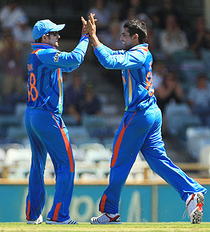 Suresh Raina celebrates a wicket with Ravindra Jadeja
