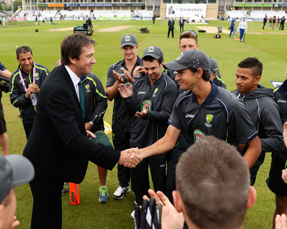 Ashton Agar receives his Baggy Green cap on his Test debut from former Australian fast bowler Glenn McGrath