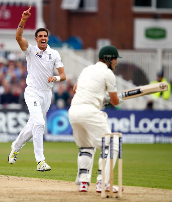 Steven Finn celebrates after taking the wicket of Shane Watson