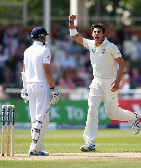 Mitchell Starc celebrates after taking the wicket of Joe Root in England's second innings