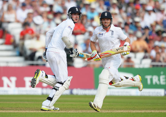 Stuart Broad (left) and Ian Bell of England run between the wickets
