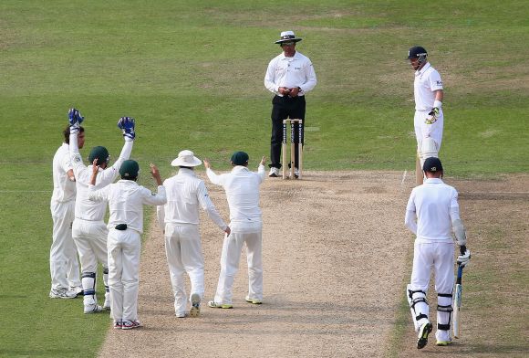 The Australian players look on after Umpire Aleem Dar turned down an appeal against Stuart Broad of England during day three of the 1st Investec Ashes Test match between England and Australia at Trent Bridge Cricket Ground