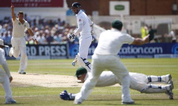 England's Stuart Broad (centre) is caught out by Australia's Brad Haddin during the fourth day