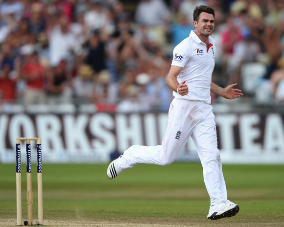 James Anderson of England celebrates the wicket of Chris Rogers of Australia