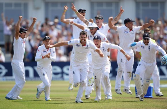 James Anderson of England celebrates the final wicket of Brad Haddin of Australia and victory with team mates during day five of the 1st Investec Ashes Test match between England and Australia at Trent Bridge Cricket Ground