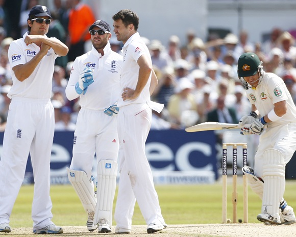 England's captain Alastair Cook signals for a television review