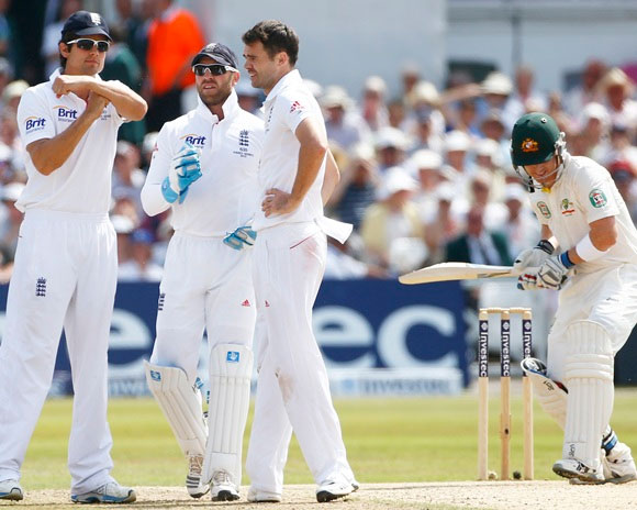 England's captain Alastair Cook signals for a television review
