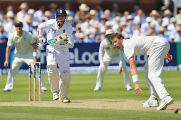 Stuart Broad hits the ball past Australia bowler James Pattinson