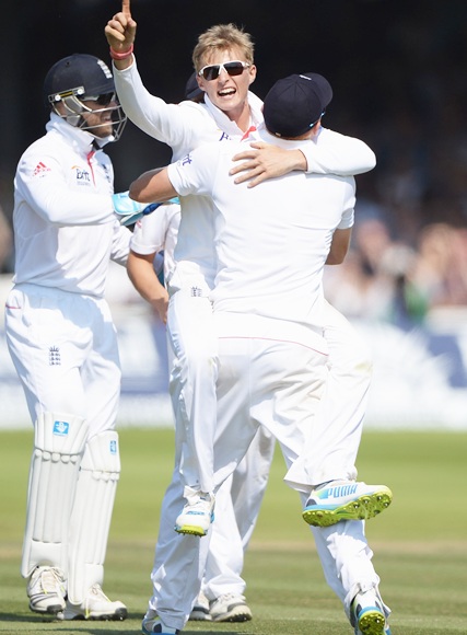 Joe Root celebrates the wicket of Usman Khawaja