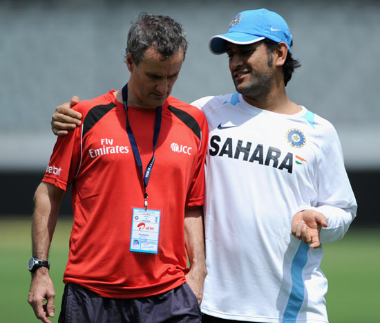 India captain Mahendra Singh Dhoni speaks with umpire Billy Bowden