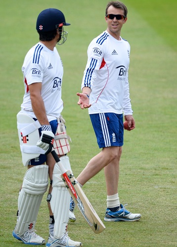 Graeme Swann of England shares a joke with Alastair Cook