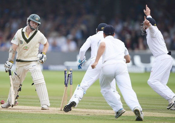  Chris Rogers is bowled by Graeme Swann in the second Test