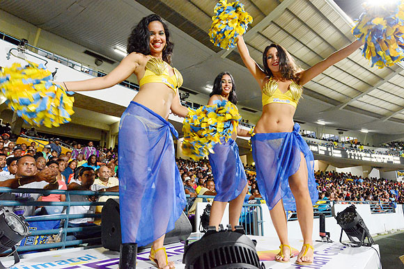 Cheerleaders and dancers perform during the opening match of the Caribbean Premier League between Barbados Tridents and St Lucia Zouks at Kengsinton Oval in Bridgetown, Barbados, on Tuesday