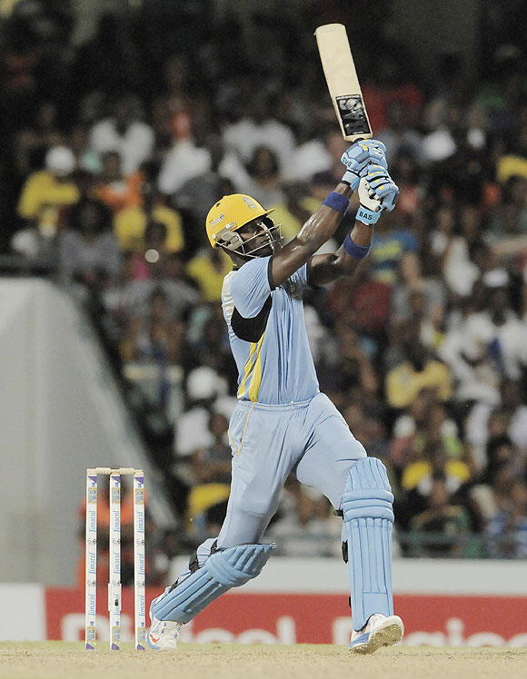 Darren Sammy of St. Lucia Zouks hits a 6 against Barbados Tridents at Kensington Oval in Bridgetown, Barbados, on Tuesday